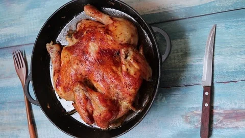4K Roast chicken in a pan on the table top view Stock-Footage 107780922