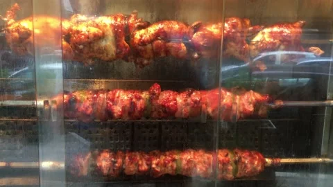 4K-Roast chickens, beef and kokoretsi in process 動画素材 146667417