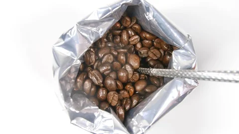 4k  Roasted coffee beans in foil bag, taking with spoon to make hot drink Stock Footage 90103157