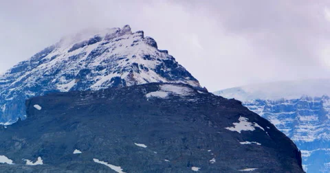 4K Rocky Mountain Summit, Clouds and Snow Stock Footage 41589231