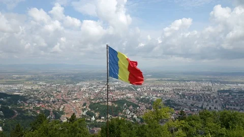 4K Romania Flag, Brasov Romania, Drone Aerial Orbit Flag Fluttering Stock Footage 119374053