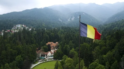 4K Romania Flag Waving in Wind Aerial Drone Flying Above Peles Castle Stock Footage 121480943