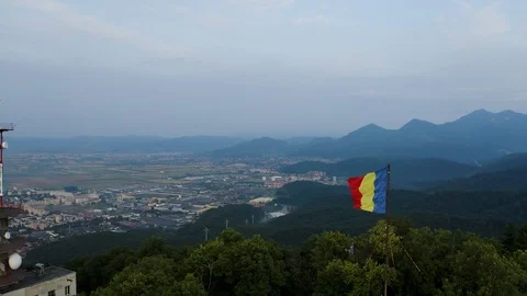 4K Romanian Flag Drone Over Brasov Stock Footage 119350182