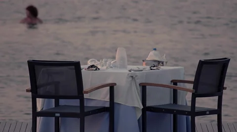 4K romantic dinner table with sea view at dusk Stock Footage 66502541
