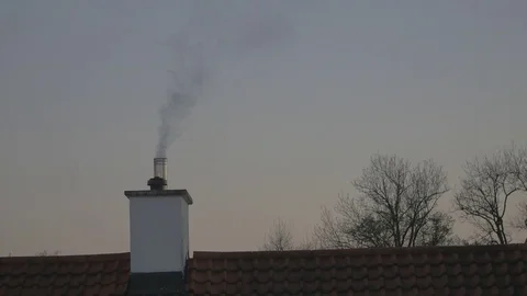 4k rooftop and chimney during sunset / dusk with smoke coming out Stock Footage 75040679