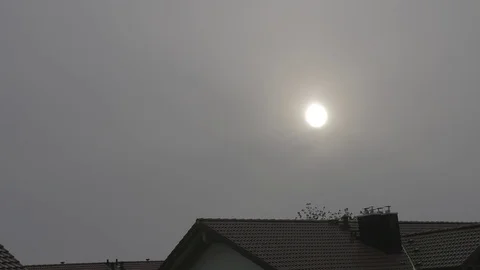 4k rooftops at dawn with the sun shining through thick haze Video stock 75132584
