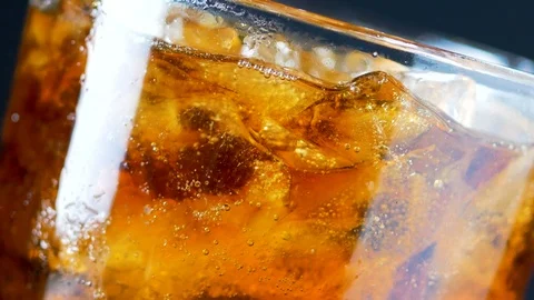 4K root beer cool ice and bouble in the glass Stock Footage 93734810
