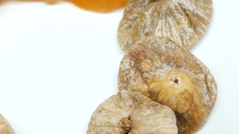 4k, Rotating dried Figs on white background in right side Stock Footage 82636034