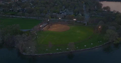 4K Rotating Drone Shot of Excelsior Commons Park On Lake Minnetonka At Dusk Stock Footage 247873833