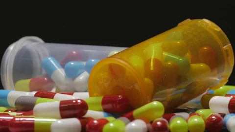 4K Rotating Medication Pills Closeup Black Background Видео 73147032
