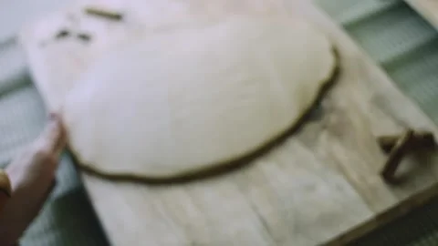 4K Round Disc of Freshly Rolled Gingerbread Dough on the Wooden Work Surface Stock Footage 342113401