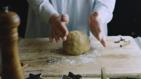 4K Round Gingerbread Dough Ball on a Lightly Floured Wooden Board Stock Footage 342113394