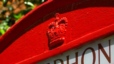 4K Royal Crown Close Up, Red Telephone Booth Box Traditional English Phone Booth Stock Footage 77163031