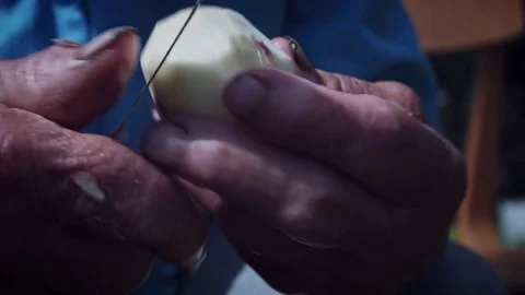 4k Rural Shot of Old Hands Peeling the Potatoes Stock Footage 79673582