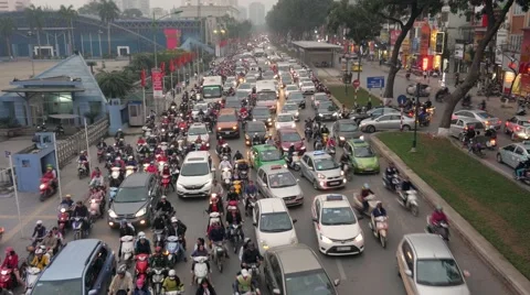 4K Rush hour in Vietnam, crowded traffic at intersection. High angle, long shot. Stock Footage 65831299