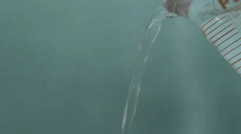 4K S-log 2 stream of water pouring from above against green screen background Stock Footage 56726460