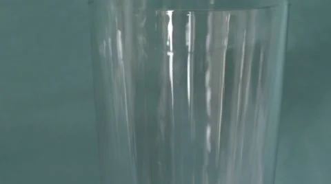 4K S-log 2 water poured into glass over green screen Stock Footage 56726208