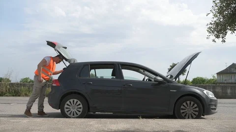 4K Safety inspector checking hood and trunk of a car Stock Footage 90801827