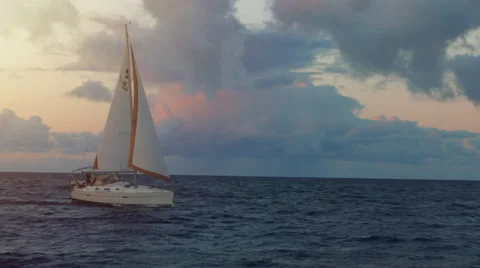 4K Sailboat on the ocean at sunset Stock Footage 42446265