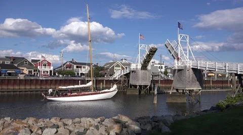 4K Sailboat sails under bridge Stock Footage 41828864