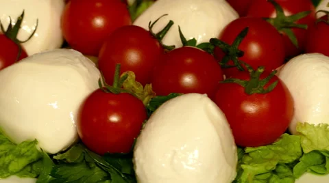 4k – Salad mozzarella with cherry tomatoes on plate 01 Stock Footage 56006110