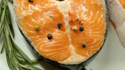 4K, Salmon. Raw Trout Red Fish Steak with Herbs and Lemon. Cooking Salmon, sea f Stock Footage 97961024