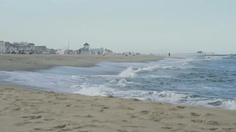4K. Sandy coast. A big, foaming wave beating against the shore. Stock Footage 130712699