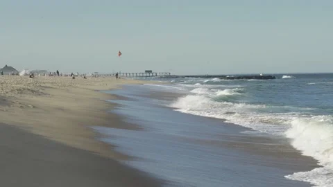 4K. Sandy coast. A big, foaming wave beating against the shore. Stock Footage 130712742
