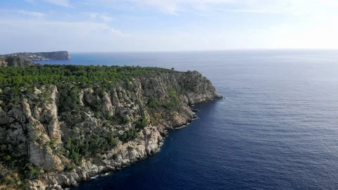 4K Scenic cliffs and deep blue water aerial shot Stock Footage 104415268