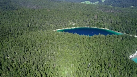 4K scenic flight of Eibsee in Bavaria on the bottom of Zugspitze Stock Footage 93083095