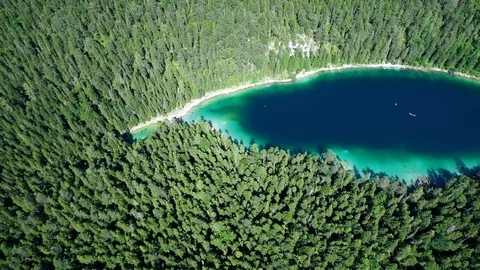 4K scenic flight of Eibsee in Bavaria on the bottom of Zugspitze Stock Footage 93083382