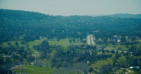 4k Scenic Mountain View over small town in valley Stock Footage 105492767