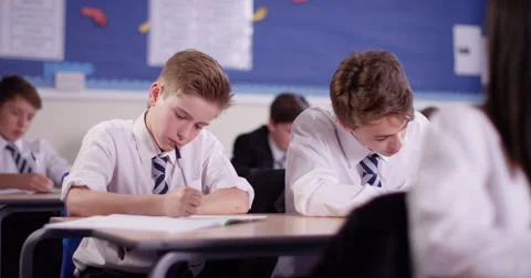 4K School children working at their desks in classroom Video stock 62991799