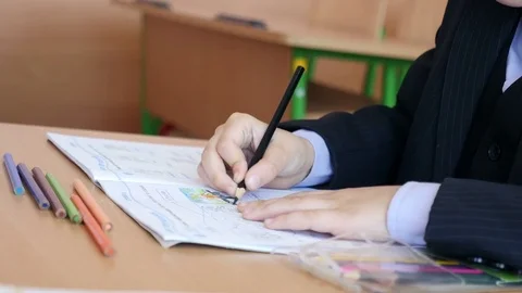 4k, schoolboy drawing in classroom at school 1 Stock Footage 70486622