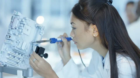 4K Scientific research engineers collaborating on project to build robotic hand Stock Footage 67756322