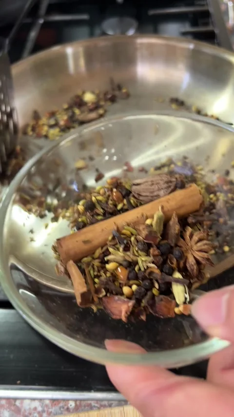 4K scooping roasted spice for making biyrani Stock Footage 248910690