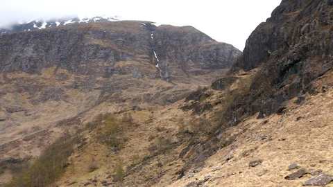 4K Scottish Highlands. Mountain range landscape of hills and rugged tourist  Stock Footage 89898914
