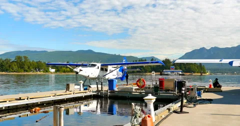 4K Sea Planes, Propeller Start, Dock with North Vancouver in Background, Canada Stock Footage 60958811