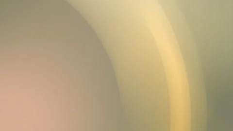 4K seamless loop background with soft beige and yellow curved gradient shapes. Stock Footage 309855744