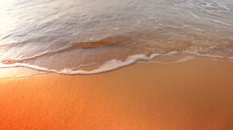 4K Seamless Loop of Barefoot Footsteps in Beach Sand, Gentle Waves Stock Footage 64727488