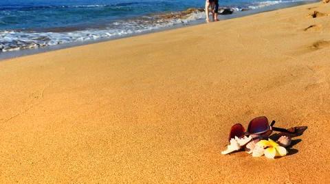 4K Seamless Looping Waves Beach, Sunglasses, Starfish, Sun Star, Plumeria Flower Stock Footage 60805848