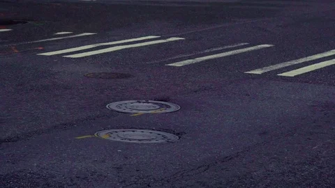 4K Seattle Washington steaming man hole cover in street Stock Footage 73499408