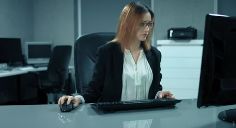 4K: A secretary is working at a computer in her office Stock Footage 66541783