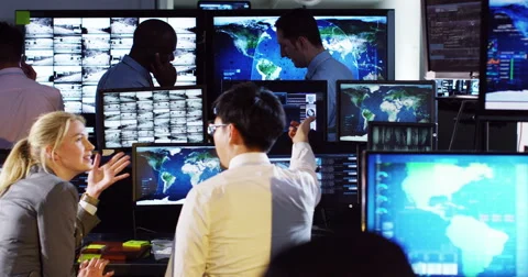 4K Security &amp; surveillance team working in a busy system control room. Stock Footage 49515065