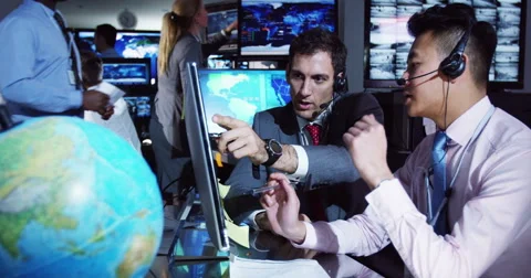 4K Security & surveillance team working in a busy system control room. Stock Footage