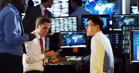 4K Security &amp; surveillance team working in a busy system control room. Stock Footage 49625458