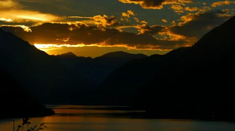 4K Setting Sun behind Epic Mountain Silhouette, Skyline Stock Footage 67468790