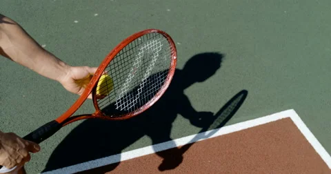 4K Shadow of tennis player throwing ball into the air to serve in super slowmo Stock Footage 67806354