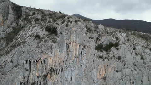 4K. Sheer mountain against the background of clouds Stock Footage 264143921