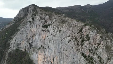 4K. Sheer mountain against the background of clouds Stock Footage 264147382